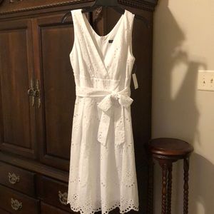 White cotton eyelet dress, faux wrap waist.